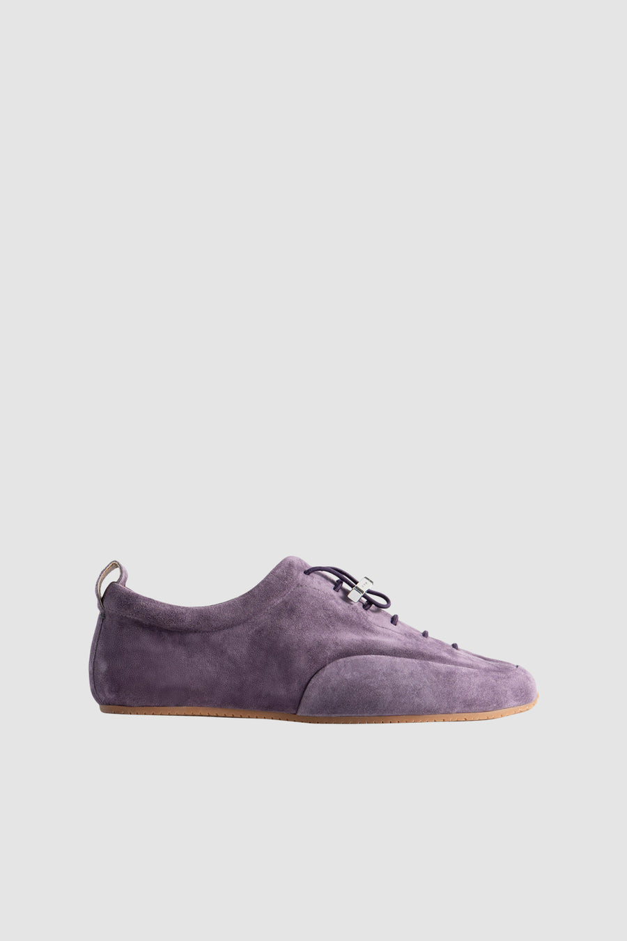 purple dress sneakers Gigi Hadid in a beautiful purple dress paired with a pair of trainers